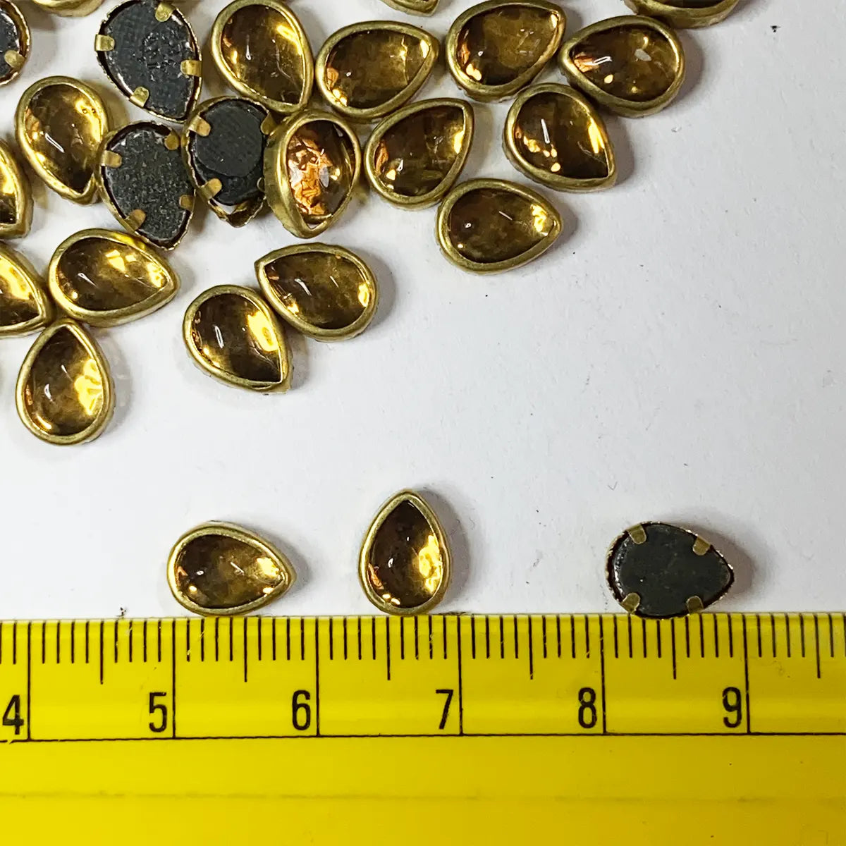 Framed Stone Flat Back Drop Shape 9x6mm Color Gold (25grams)