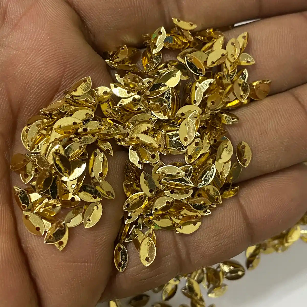 Golden Colour 2 Hole Leaf Shape Sequins Size 6×4 mm – 10grams