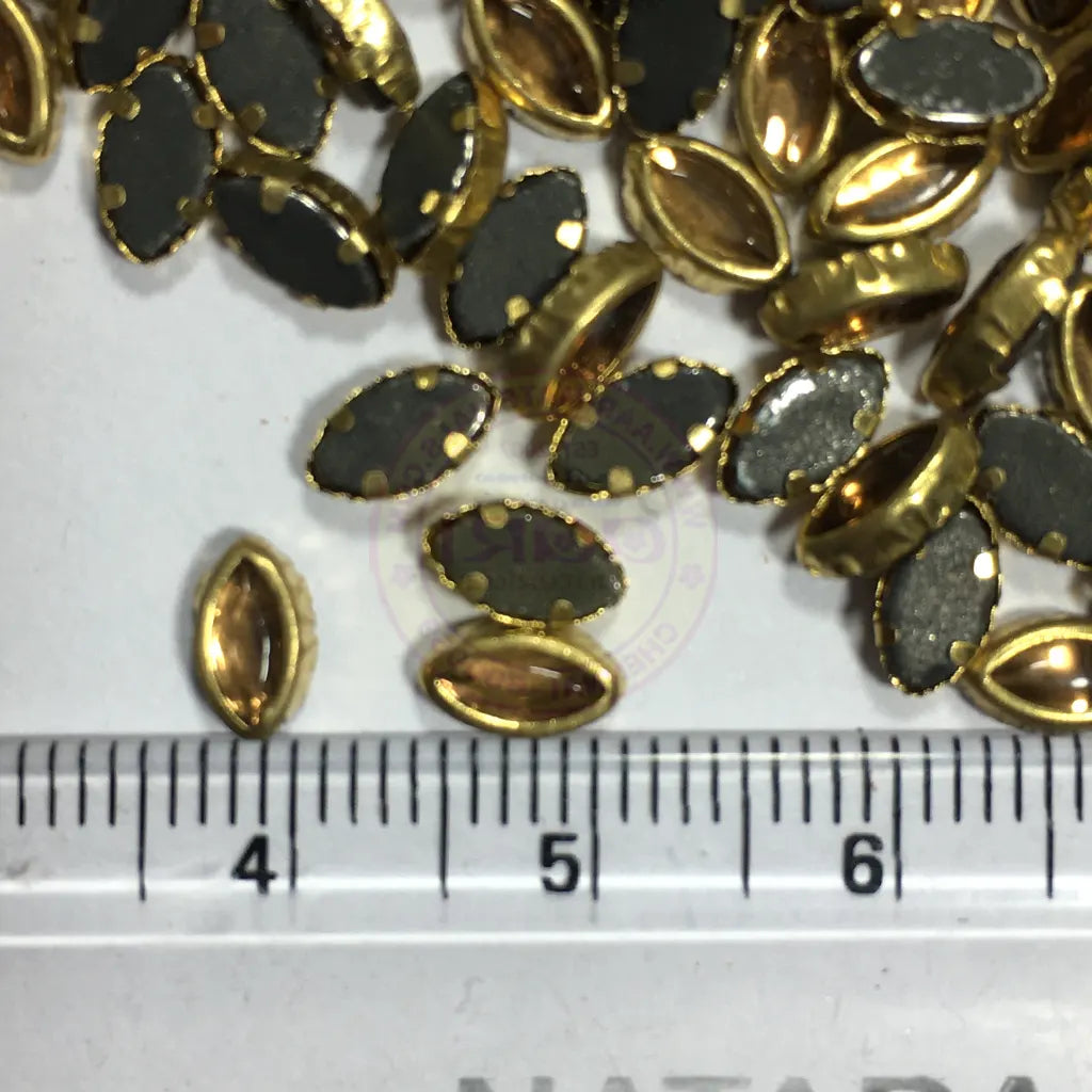 Kundan Stone Flat Back Framed Eye Shape 6mmX4mm Color Gold (25grams)