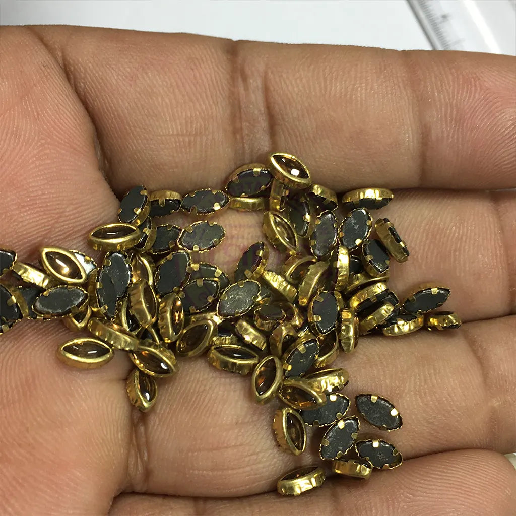 Kundan Stone Flat Back Framed Eye Shape 6mmX4mm Color Gold (25grams)