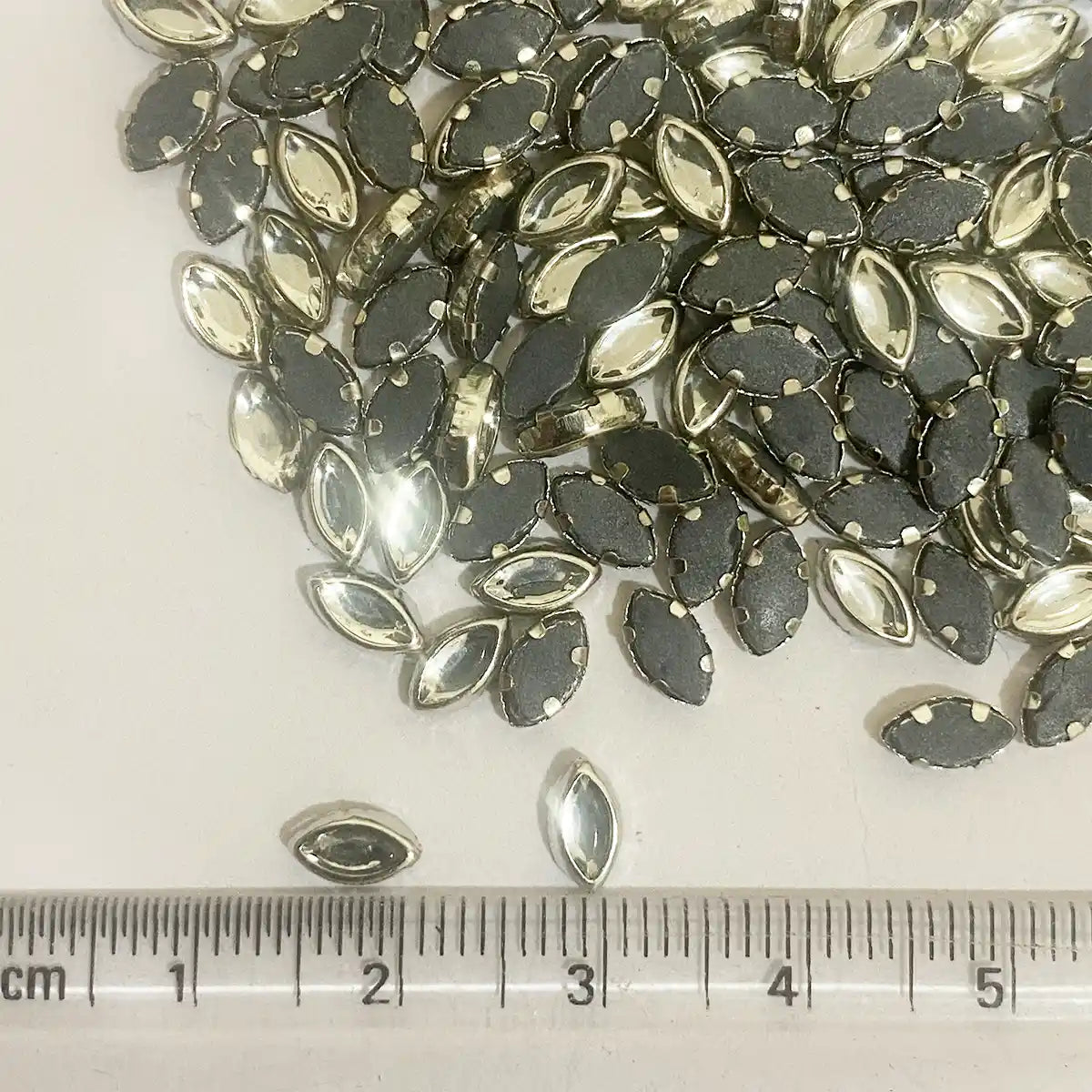 Kundan Stone Framed Eye Shape (6K) 6mmX4mm White Color Silver Base (20grams)