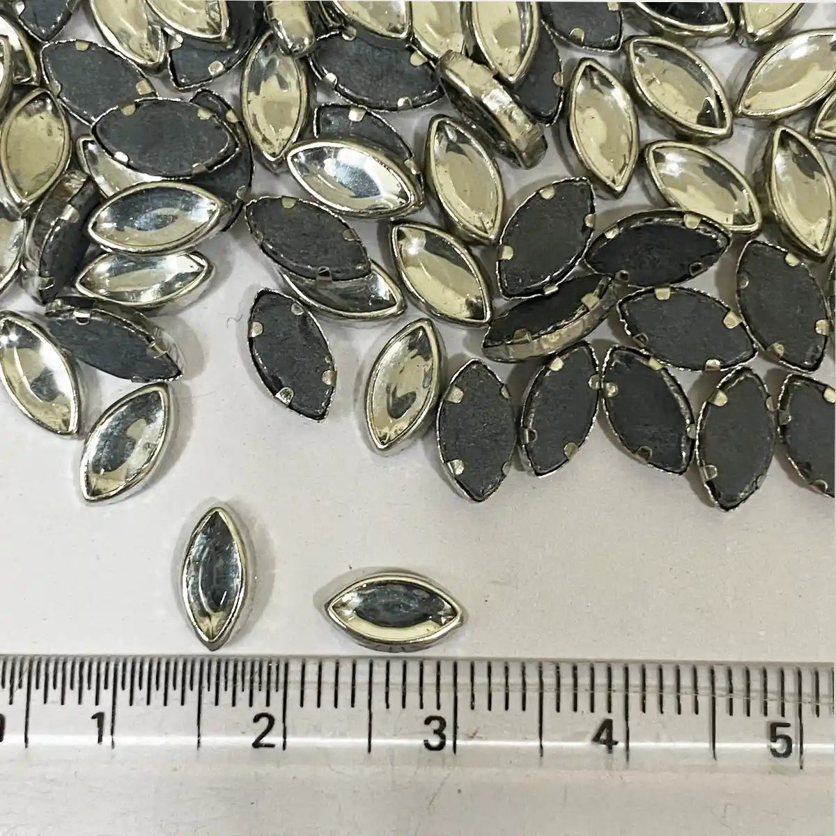 Kundan Stone Framed Eye Shape (8K) 8mmX5mm White Color Silver Base (20grams)
