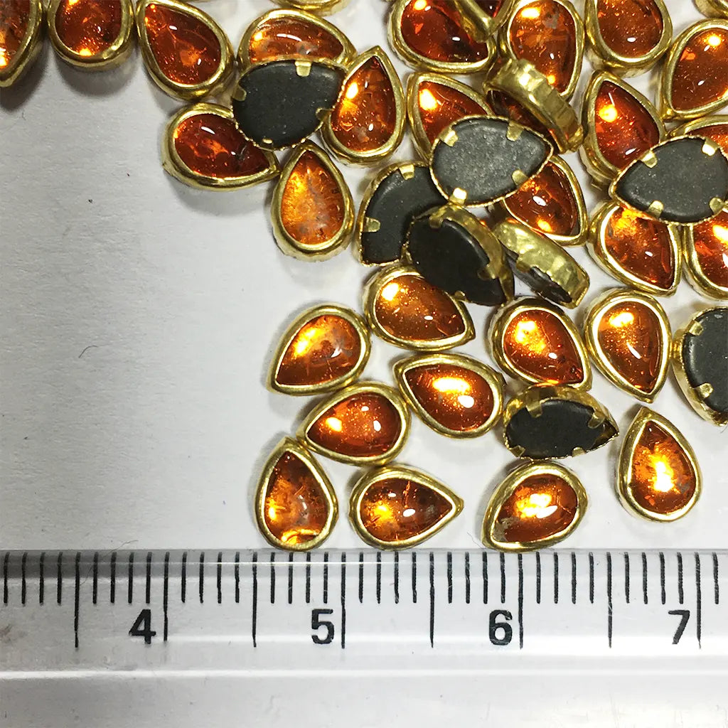 Glass Kundan Stone Framed Teardrop Shape Orange Color 6mmX4mm (20grams)